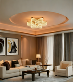Modern living room with beige sofa, armchair, and stylish chandelier.