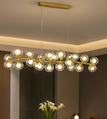 Modern chandelier with glass bulbs in a room setting