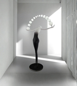 Modern floor lamp with spherical design in a minimalistic room