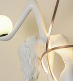Modern wall light fixture with white and gold design on a neutral background