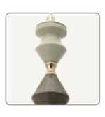 Decorative candle holder with gold accents on a white background