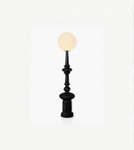 Black decorative lamp with a white bulb on a white background