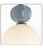 Two-toned lamp with a blue upper shade and white lower shade on a white background