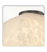 Ceiling light fixture with textured white glass shade and black metal fixture