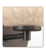 Wall-mounted light fixture with a glass shade on a white background