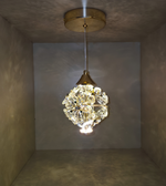 Crystal pendant light fixture hanging from a ceiling