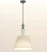 A modern pendant light fixture with a tapered beige pleated fabric shade, a white glass accent cone, and a black suspension rod and ceiling canopy, shown against a plain off-white background.