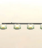 A modern linear ceiling light fixture with four cylindrical frosted glass shades and a matte black horizontal bar, shown against a plain off-white background.