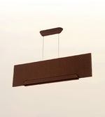 A modern rectangular pendant light fixture in a dark brown finish with a subtle chevron pattern, suspended by two thin cables against a plain off-white background.