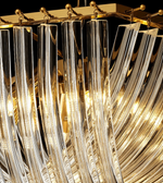 Close-up of a chandelier with crystal-like design and gold accents.