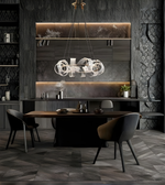 Modern dining room with dark wood table and chairs, marble backsplash, and decorative wall.