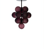 Cluster of dark purple spherical lights on a white background