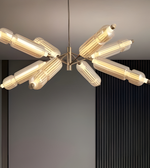 Modern chandelier with cylindrical lights on a neutral background