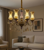 Luxurious chandelier hanging above a living room with a sofa and decor.