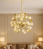 Decorative chandelier hanging above a living room with beige walls and lamps.