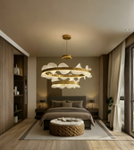 Modern bedroom with a stylish chandelier, bed, and wooden furniture.