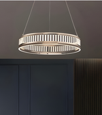Modern pendant light hanging above a dark cabinet