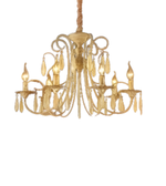 Gold chandelier with multiple lights on a white background
