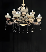 Decorative chandelier with crystal accents on a black background