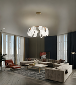 Modern living room with a stylish chandelier, sofa, and coffee table.