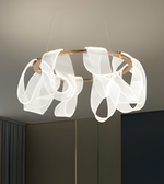 Modern ceiling light fixture with white ribbons on a neutral background