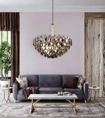 Modern living room with a chandelier, gray sofa, and wooden coffee table.