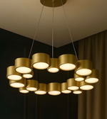 Gold chandelier with multiple lights in a dark room setting