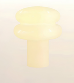 A pale cream-colored plastic or resin knob with a rounded, mushroom-like top and a cylindrical base, shown against a plain light background.
