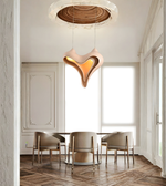 Modern dining room with a unique pendant light fixture.
