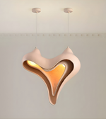 Modern pendant light with a unique design on a neutral background