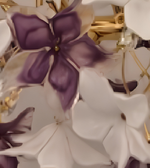 Close-up of sculptural white and plum-purple flower elements with gold-toned detailing on a floral chandelier.