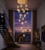 Elegant floral crystal cascade staircase chandelier by Daya Worldwide, featuring sparkling crystal details and a double-height design.
