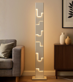 Modern LINEA STEPS LED floor lamp by Daya Worldwide featuring sleek design and adjustable lighting for contemporary spaces.