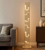 Modern architectural LED floor lamp with geometric stepped light design in living room