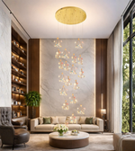 Elegant cascading floral chandelier with gold ceiling plate in modern luxury interior space