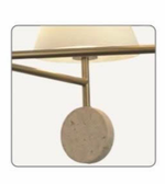 Decorative lamp with a round beige base and gold fixture on a white background