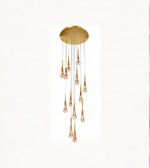 Gold pendant light fixture on a white background