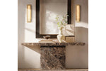 Pair of slim wall sconces mounted beside mirror for accent lighting