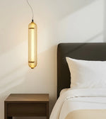 Amber Aura pendant light by Daya Worldwide hangs from the ceiling, featuring warm amber-colored glass and elegant design.