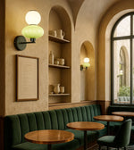 Daya Worldwide ORBA wall light mounted on a wall, showcasing modern design and sleek illumination for home decor.