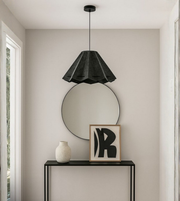 Origami-style black gray foam pendant hanging above modern hallway console