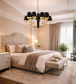 Black shade chandelier with brass arms illuminating a luxury bedroom interior with warm ambient lighting