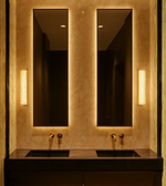 Crystal Bubble Vanity Wall Light installed vertically beside twin mirrors in a luxury bathroom with warm lighting.