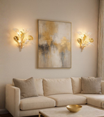 Gold and white designer wall lamp shaped like blooming flowers