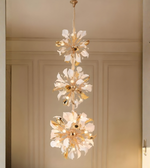 Triple bloom chandelier in a modern luxury hallway