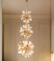 Triple bloom chandelier in a modern luxury hallway