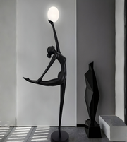 Modern ballet sculpture floor lamp by Daya Worldwide, featuring a sleek, artistic statue design with integrated lighting.