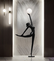 Modern ballet sculpture floor lamp by Daya Worldwide, featuring a sleek dancer statue with integrated lighting for elegant decor.