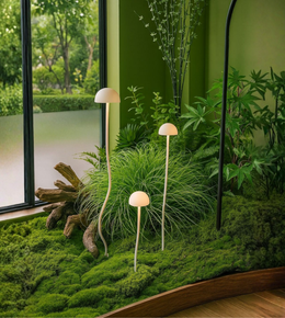 Mushroom-style garden spike lights glowing softly among lush green plants