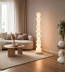 Modern marble effect stacked floor lamp glowing in cozy living room corner